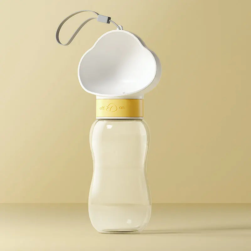 Portable pet water bottle from Nick's Super Store showing a compact, handheld design with a water reservoir and fold-out bowl for pets
