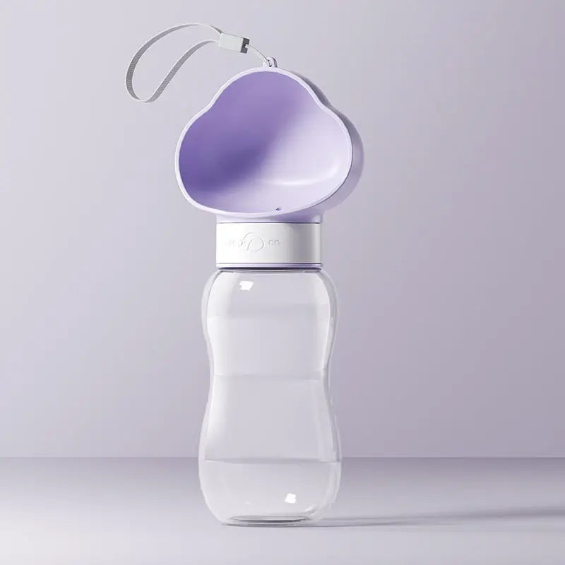 Portable pet water bottle from Nick's Super Store showing a compact, travel-friendly water bottle for dogs and cats with a built-in bowl.