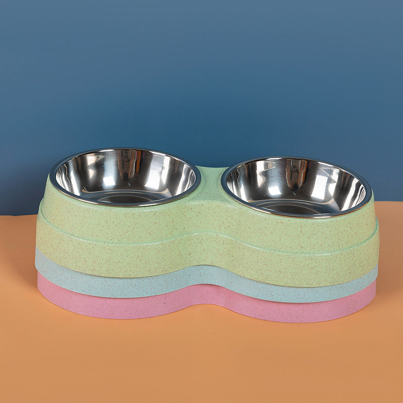 Double stainless steel pet bowl with two compartments for food and water, ideal for pets' feeding stations.