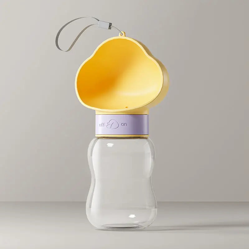 Portable pet water bottle from Nick's Super Store with a built-in water dispenser for pets on the go.
