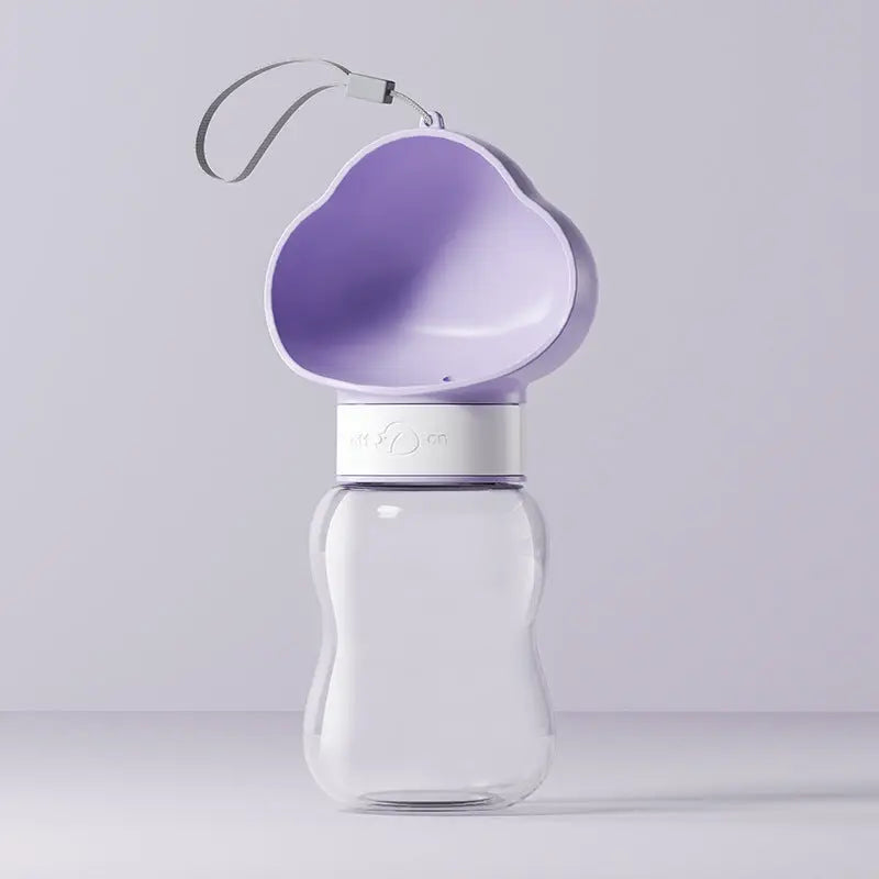Portable pet water bottle from Nick's Super Store showing a compact, handheld design with a water reservoir and spout for pets.