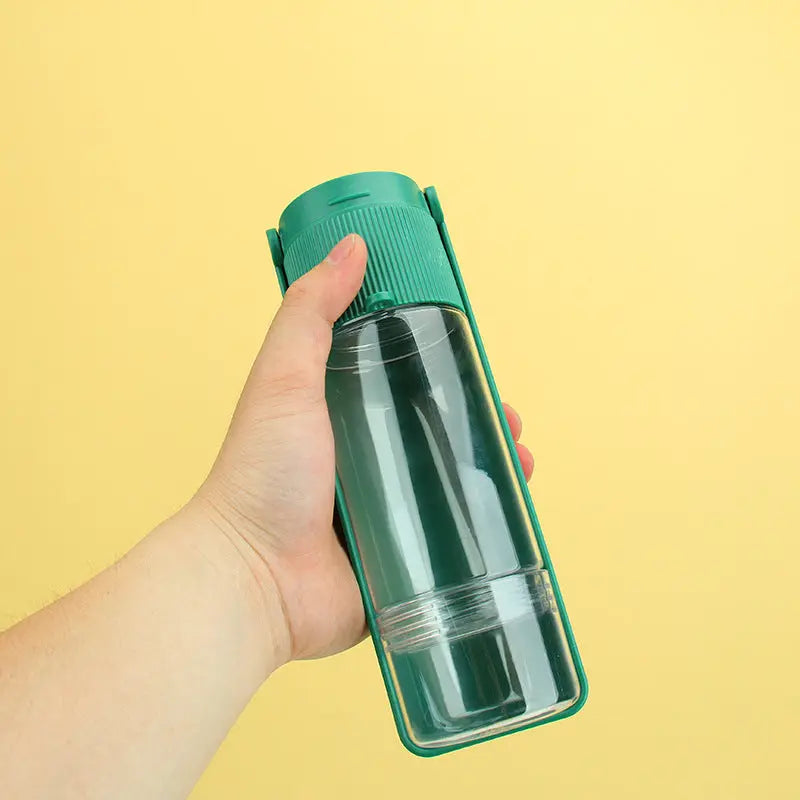 Mini camera from Nick's Super Store featuring a portable dog water bottle with built-in drinking nozzle for pet hydration on the go
