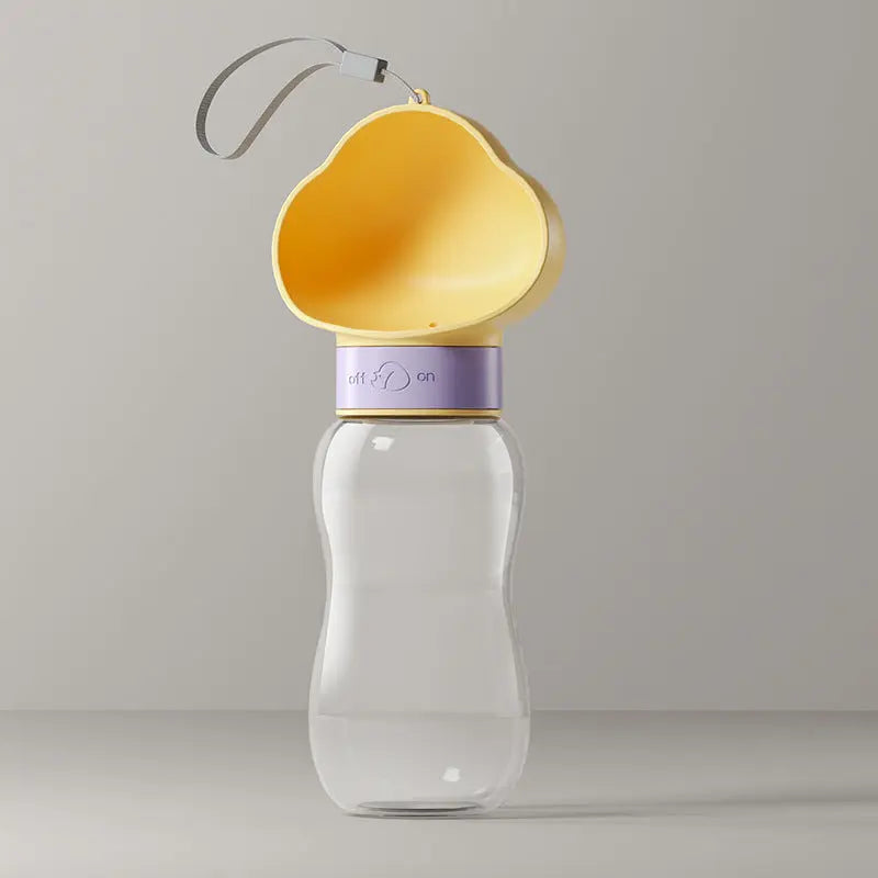 Portable Nick's Super Store pet water bottle with a collapsible silicone bowl for easy hydration during walks.
