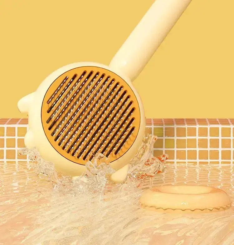 Green Nick's Super Store pet comb and massage brush for cats and dogs, with stainless steel teeth for grooming and hair removal.