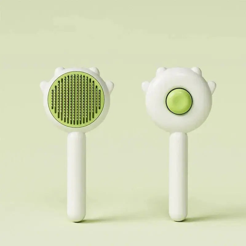 Green cat and dog grooming comb with massage and hair removal features, made of ABS plastic and stainless steel.