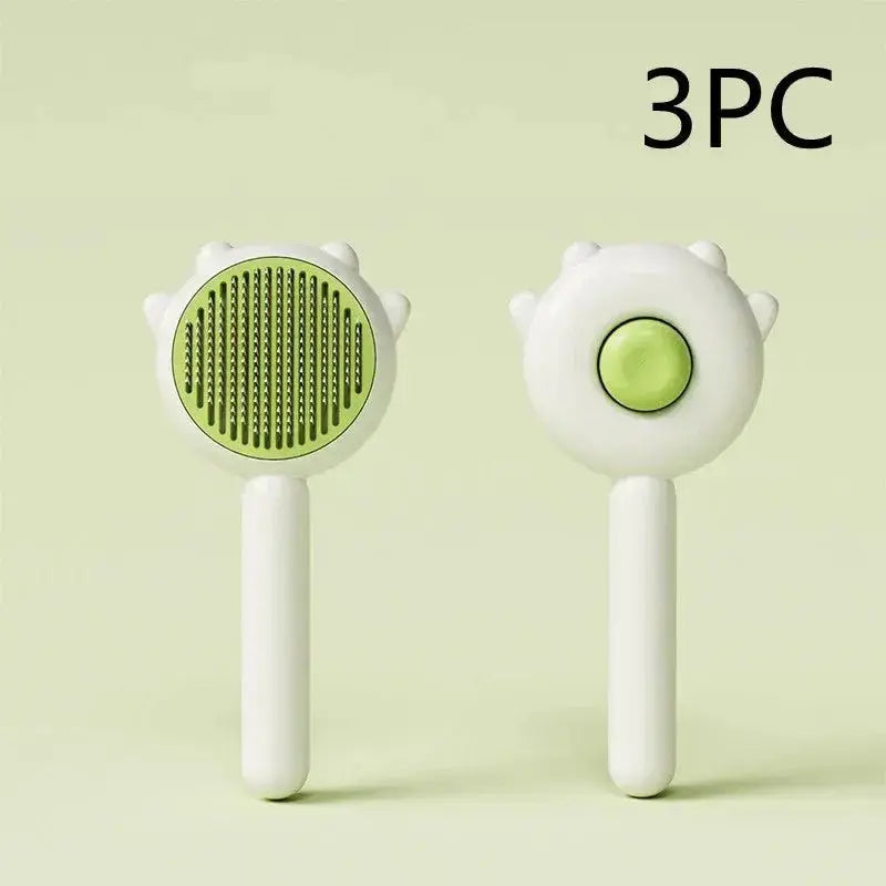 Green pet comb and massage brush for cats and dogs, made of ABS and stainless steel, used for grooming and hair removal.