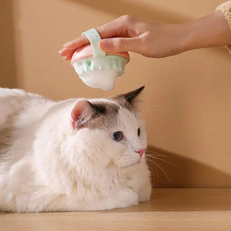 Pet silicone bath brush for cats and dogs, gentle massaging grooming tool for soft fur, from Nick's Super Store.